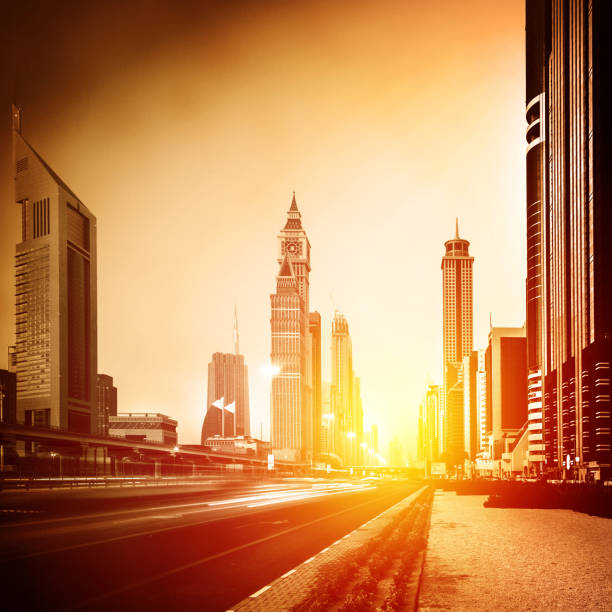 Dubai city in sunset, bright yellow sun light, beautiful panorama of modern architecture, financial centre, luxury district, business city concept