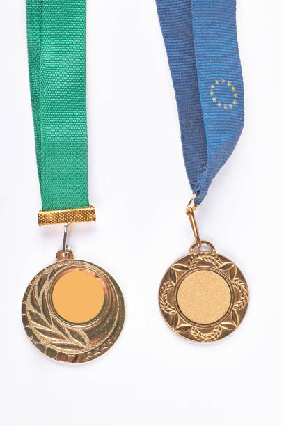 istock Two golden medals hanging on tapes. 871574200