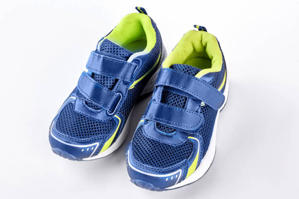 istock Pair of blue trainers on white background. 871577164