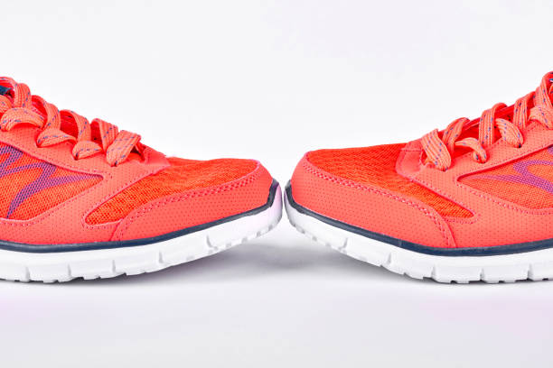 istock Orange sport shoes, white background. 871577738