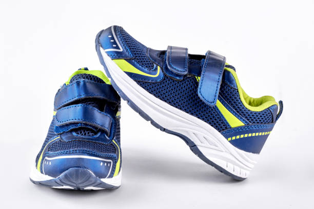 istock Blue and green sport trainers. 871577958
