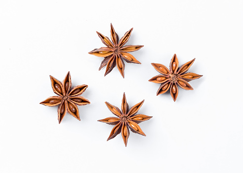 Anise star  on white background. Aniseed. True star anise close up. Badiane. Spices.