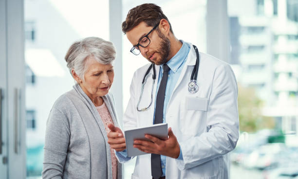 Running through a treatment plan with a patient stock photo