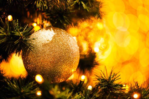 istock Fir branch with balls and festive lights 871585486