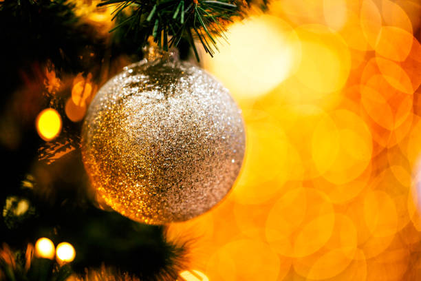 istock Fir branch with balls and festive lights 871585744