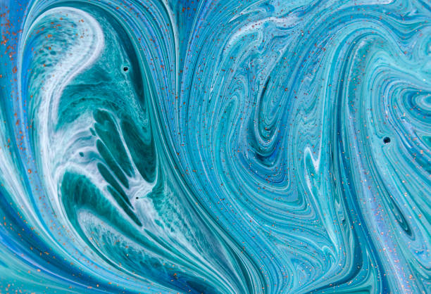 istock Marbled blue abstract background with golden sequins. Liquid marble ink pattern. 871588662