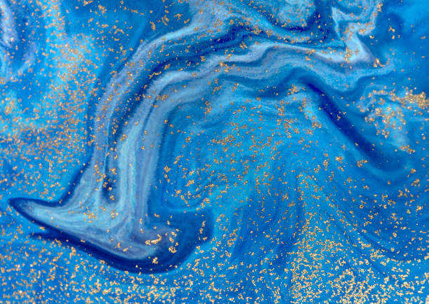 istock Marbled blue abstract background with golden sequins. Liquid marble ink pattern. 871589338
