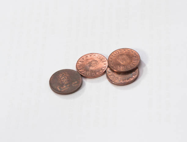 istock Four coins worth  5 Romanian Bani isolated on a white background 871589444