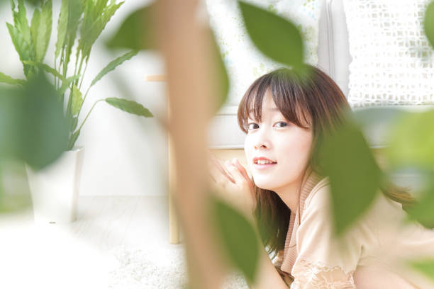 istock Young woman relaxing at home 871595418