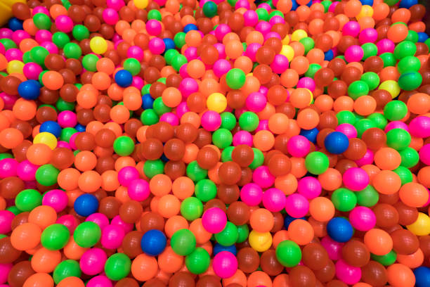 istock Colorful plastic balls in children park 871602108
