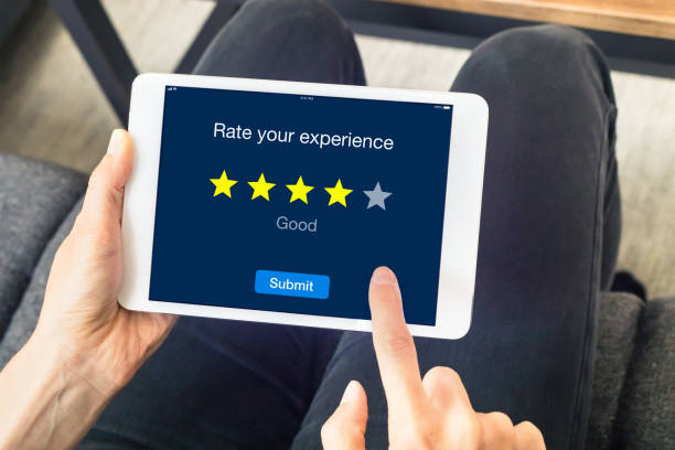 istock Person using digital tablet computer sending customer rating online, stars 871604976