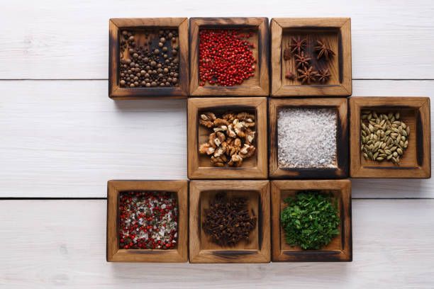 istock Diverse spices in a wooden box closeup 871608820