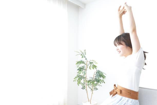 istock Young woman relaxing in the room 871610228