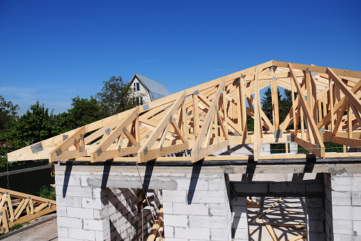 Roof trusses. Roofing Construction House Roof Building.Timber roof truss. Trusses and Framing Home Roof. Engineered Roof Trusses.