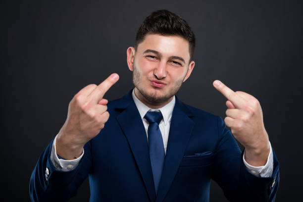 istock Arrogant lawyer rising both middle fingers 871610752