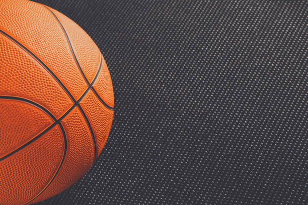 istock Old basketball ball on black background copy space 871613096