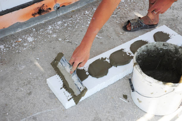 istock Contractor Insulation House Foundation with styrofoam insulation sheets. Wall insulation with foam board. Rigid Foam Insulation 871613814