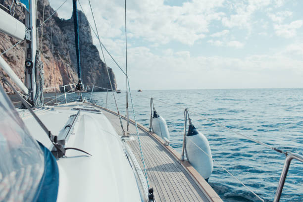 istock Yacht sailing in the tropical sea 871616874