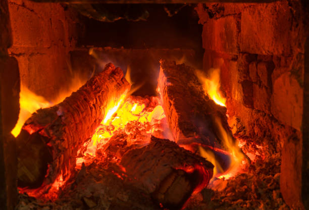 istock Logs burning in ancient peasant masonry oven in Ukraine 871621796