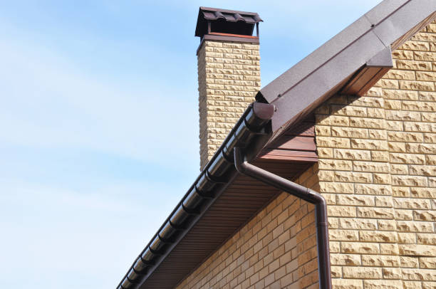 istock Rain Gutter Corner Repair. Roof Guttering installation with Chimney, Rain Chain Pipe and Holder. 871624904