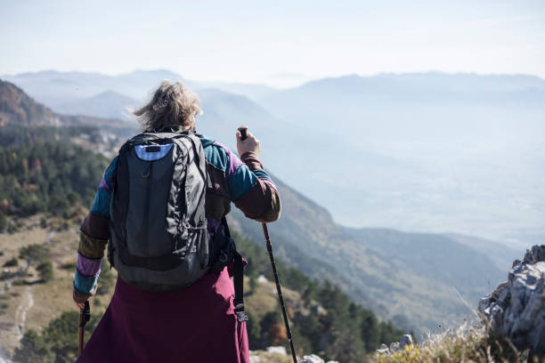 istock Mature Woman Hiking in Mountains 871628252