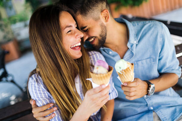 istock Happy couple having date and eating ice cream 871628860