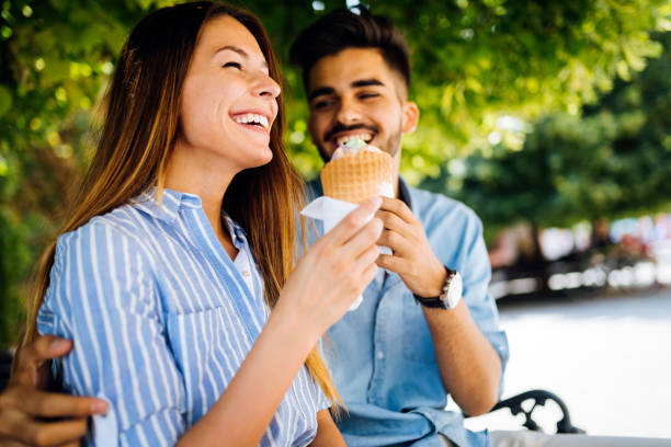 istock Happy couple having date and eating ice cream 871628980