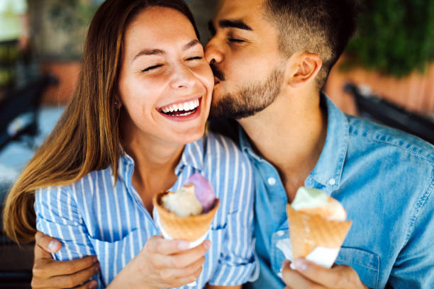 istock Happy couple having date and eating ice cream 871629008