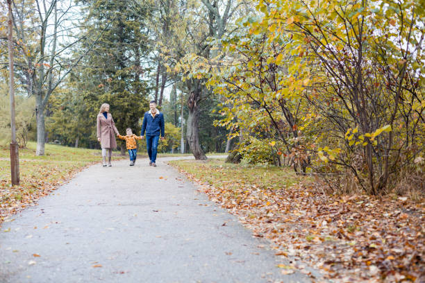 istock autumn forest walk with the son family 871634282