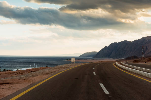 istock Asphalt road in desert Dahab, Egypt 871634910