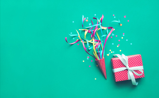 Celebration,party backgrounds concepts ideas with colorful confetti,streamers and gift box.Flat lay design