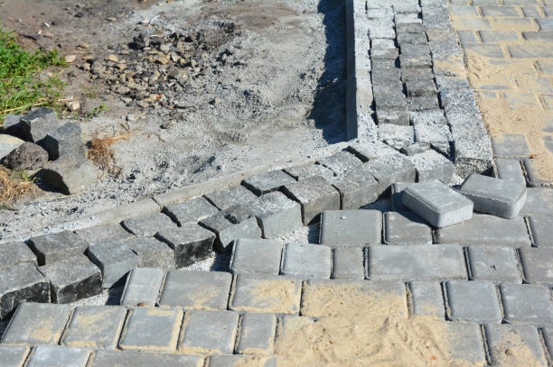 istock Installing pavers for garden pathway with road curb, kerb stones 871641536