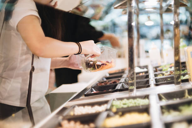 istock Woman hand fork over for salad 871642934