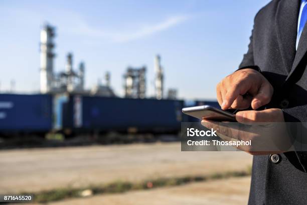 Businessman Checking Around Oil Refinery Plant With Clear Sky Stock Photo - Download Image Now