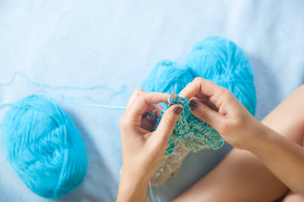 istock Close-up woman  knitting 871652874