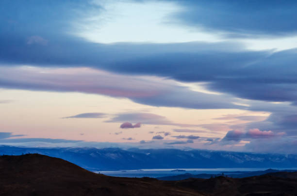 istock Beautiful red sunset over the lake with mountain 871653392