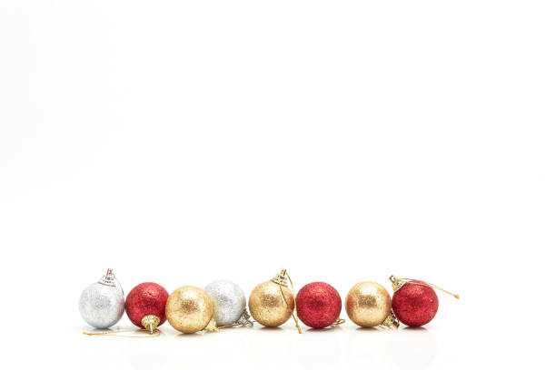 istock beautiful red gold and silver Christmas balls on white 871655694