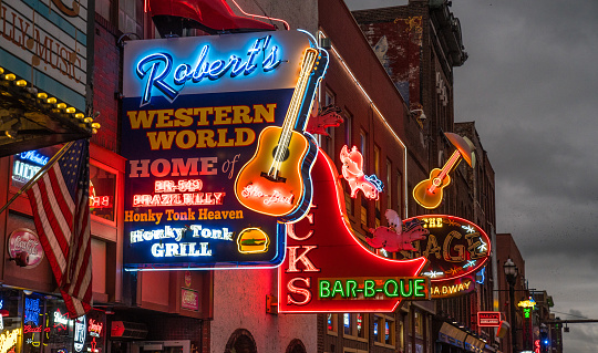 Nashville, Tennessee - October 8, 2017: Neon signs light the strip along Broadway in Nashville
