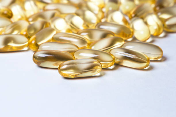 istock omega 6: conjugated linoleic acid (CLA) in capsules on the white background 871659922