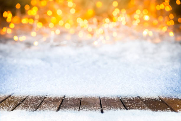 istock empty snowy wooden planks christmas bokeh background 871660024