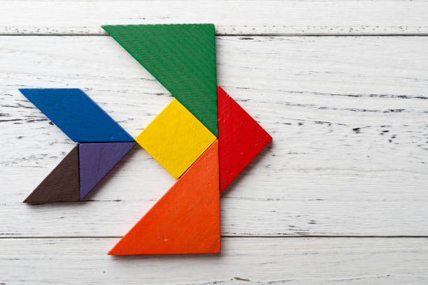 istock wooden tangram in a swallow shape 871660454