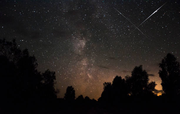 istock Meteor in the starry sky 871661250