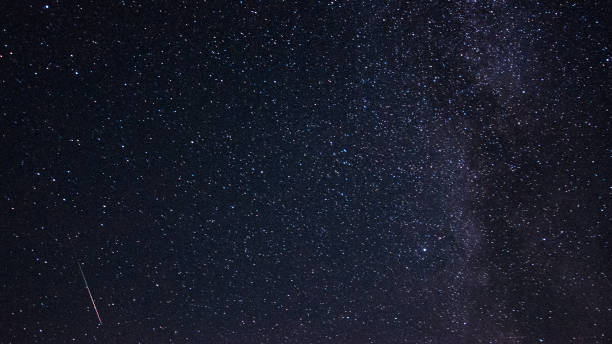 istock Meteor in the starry sky 871661278