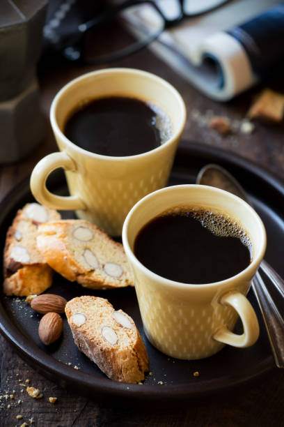 istock Two cups of black cofee with biscuits 871671958