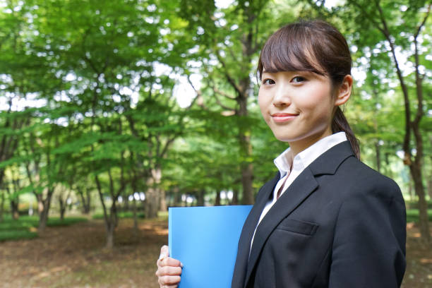 istock Young business woman walking outside 871672422