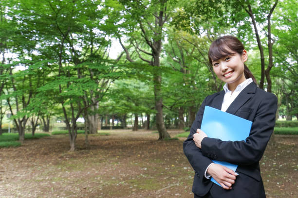 istock Young business woman walking outside 871672472