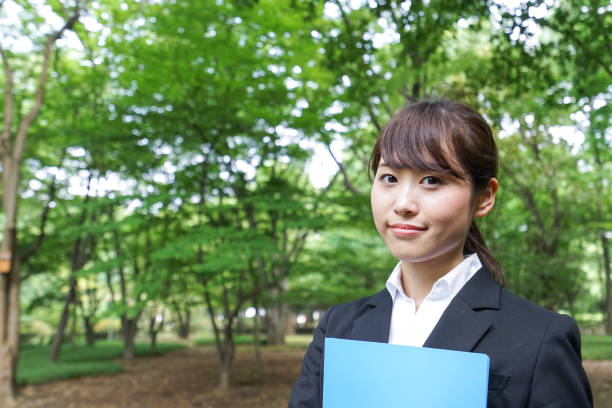 istock Young business woman walking outside 871672564