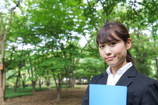 istock Young business woman walking outside 871672638
