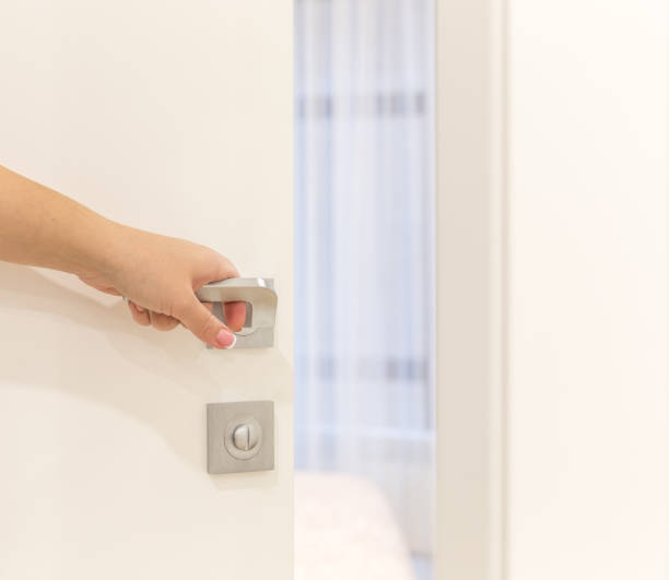 istock Woman's hand opening door in bedroom 871672878