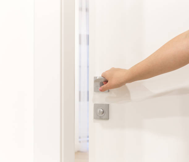 istock Woman's hand opening door in bedroom 871675316